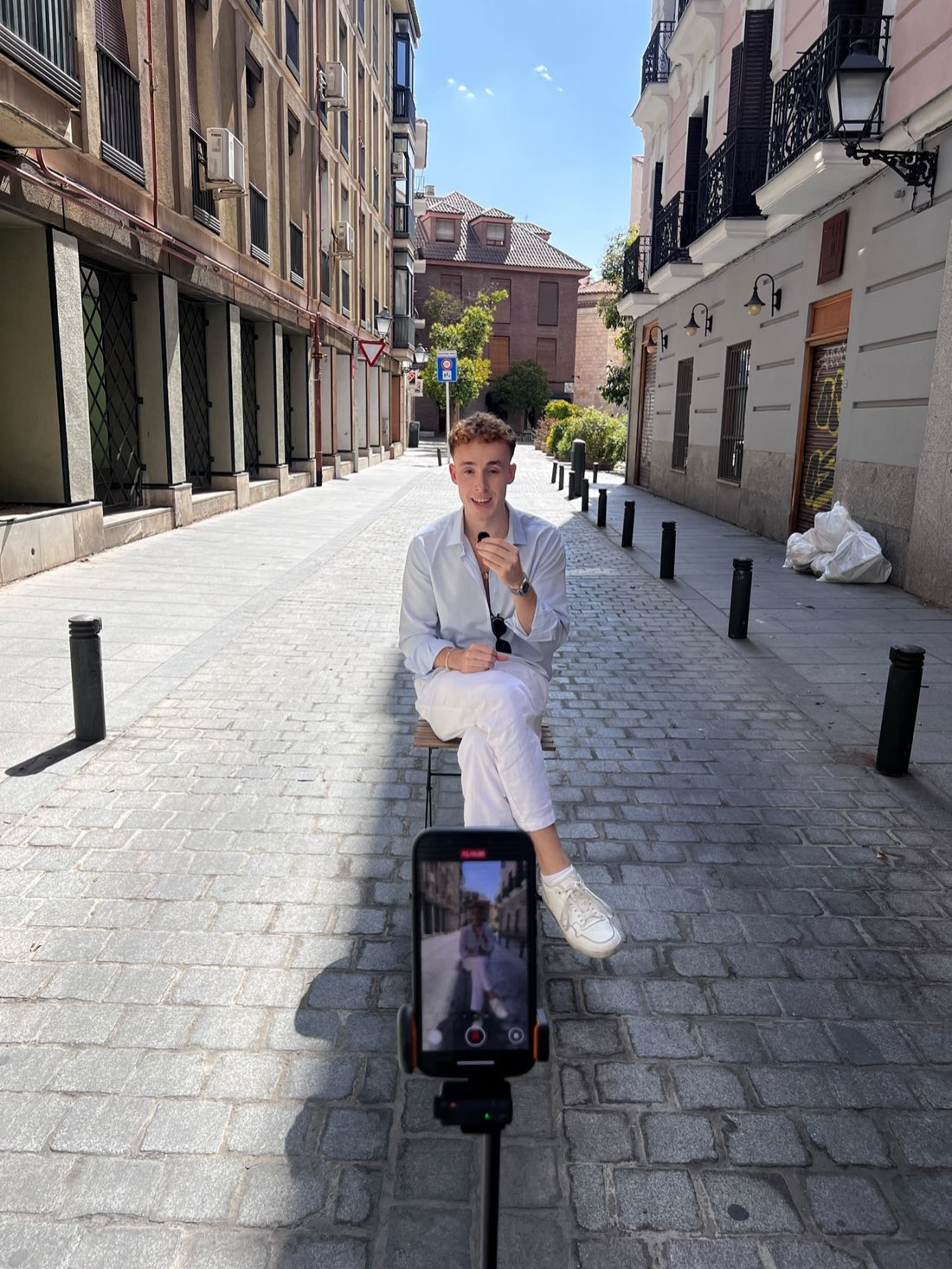Felix Padilla Engstrom filming a video on a street in Madrid